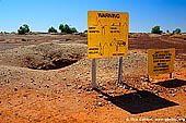 australia stock photography | Warning Sign at White Cliffs Opal Mines, White Cliffs, NSW, Australia, Image ID WHITE-CLIFFS-OPAL-MINES-0007. 