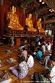 korea stock photography | In Prayer for Buddha Inside Jogyesa Temple in Seoul, South Korea, Gyeonji-dong, Jongno-gu, Seoul, South Korea, Image ID KR-SEOUL-JOGYESA-0011. 