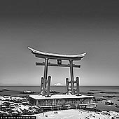 portfolio stock photography | Torii Gate of the Toyosaki Konpira Shrine, Shosanbetsu, Hokkaido, Japan. The village of Shosanbetsu is located along a stretch of the Sea of Japan's coast. Running south to north, the Ororon Line transports people through the area. With the beautiful coast on one side, it is easy to see why droves of photographers have been making their way to Shosanbetsu. Especially popular is the red torii gates of the Toyosaki Konpira Shrine that stand alone and vibrantly off the coast of Cape Konpira. Why not visit this spot and try your hand at capturing the striking red structure contrasted against the beautiful blue sky and ocean? Or, maybe you are more of a romantic and would prefer shooting the setting sun glowing through the gate? Night owls might want to come out on a starry night and watch the torii be enveloped by the cosmos. Whatever your preference, the Toyosaki Konpira Shrine gates will not disappoint!
