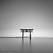 portfolio stock photography | Shirahige-jinja Shrine Floating Torii at Lake Biwa, Takashima, Shiga Prefecture, Japan, Image ID JAPAN-LAKE-BIWA-0001. Many people are familiar with the big red torii standing in the sea on Miyajima, but Lake Biwa also has a 'floating' torii. It is located on the western side of Lake Biwa, at Shirahige Shrine near Takashima. Although it is much smaller than its Miyajima counterpart, it creates a beautiful view set against the constantly changing moods of the lake. The shrine is considered to be a good place to pray for longevity, matchmaking, having a baby, better luck and prosperous business. The large, vermilion-lacquered torii gate is like the symbol of Shirahige-jinja Shrine, and has been a draw for visitors for many years.