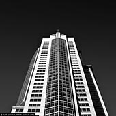 portfolio stock photography | Chifley Tower, Sydney, NSW, Australia. Chifley Tower is a skyscraper in Sydney, Australia. It was designed by New York City-based architects Travis McEwen and Kohn Pedersen Fox, with John Rayner as project architect. At a height of 244 metres (801 feet), Chifley Tower was the tallest building in Sydney from 1992 to 2019. It was surpassed in height by Crown Sydney (271 metres) in 2020 along with the Salesforce Tower (263 metres) and One Sydney Harbour (247 metres) in 2022. One of the highlights of the present day Sydney skyline, Chifley Tower is a Post Modern office tower incorporating the latest in structural technology wrapped in a form reminiscent of of the picturesque romantic skyscrapers of early 20th century America. The building was originally named Bond Tower, after Alan Bond. After Bond's bankruptcy, the building was acquired by Kumagai Gumi, and in 1993 was renamed Chifley Tower, after the square. The retail arcade located in the podium building is named Chifley Plaza.