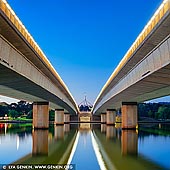 australia stock photography | Commonwealth Bridge at Dawn, Canberra, ACT, Australia, Image ID AU-ACT-CANBERRA-0008. Commonwealth Avenue is a major road in Canberra, Australian Capital Territory, Australia. It connects Civic with South Canberra. Specifically, it runs between City Hill and Capital Hill. The first Commonwealth Avenue Bridge was constructed in 1928. It replaced a ford across the Molonglo River. The road crosses Lake Burley Griffin over the Commonwealth Bridge. The Commonwealth Bridge is a part of a popular 'bridge to bridge' walk - Commonwealth Bridge to Kings Avenue Bridge.