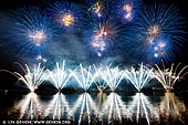 australia stock photography | Skyfire 2018 Firework Display over Lake Burley Griffin, Canberra, Australian Capital Territory (ACT), Australia, Image ID AU-CANBERRA-FIREWORKS-SKYFIRE-0003. Skyfire is an annual March fireworks show held over Lake Burley Griffin in Canberra, Australia since 1989. The event is funded by local radio station FM 104.7, and the display is synchronised to a soundtrack of music broadcast on the station. Skyfire 2018 delivered a magnificent display of fireworks as part of The Enlighten Festival. It's Canberra's biggest night of fireworks - and this year the event turns 30. The fireworks display was 18 minutes of extravagant lights and explosions timed to hits provided by 104.7 including some classics from across the 30 years of Skyfire events.