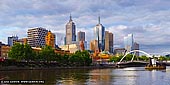 australia stock photography | Melbourne and Flinders Street Station, South Bank, Melbourne, VIC, Australia, Image ID AU-MELBOURNE-0002. The city of Melbourne is made up of the city centre and a number of precincts and inner-city suburbs that have their own distinctive character. Melbourne is the capital of Victoria and a vibrant hub of style, sport, culture and dining. Melbourne is a maze of hidden laneways, opulent bars, exclusive restaurants and off-the-beaten-track boutiques. Melbourne is a fascinating mix of striking modern and historic architecture, which ensures the skyline is constantly changing.