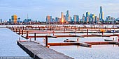 australia stock photography | Melbourne from St Kilda Beach, Melbourne, VIC, Australia, Image ID AU-MELBOURNE-0006. Melbourne's most famous beach is located just 6km from Melbourne city centre, and its expanse of sand and its promenade, pier and harbour, marine clubs, sea baths and restaurants set St Kilda apart from any other Melbourne area. Take a walk down St Kilda Pier and enjoy views of the Melbourne skyline and Port Phillip Bay. See if you can spot the Little Penguins that call the area home!