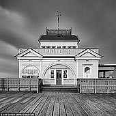 australia stock photography | St Kilda Pavilion, Melbourne, VIC, Australia, Image ID AU-MELBOURNE-0009. Originally known as Parer's Pavilion, The St Kilda Pavilion is a historic landmark which was built in 1904, and sits proudly welcoming any traveler willing to walk the planks, so to speak. In September 2003 the Pavilion was tragically burned to the ground after an arson attack, however the building was restored in March 2006. It was reconstructed using the original plans from 1904 and some parts that were salvaged from the original building.