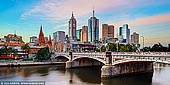 australia stock photography | Melbourne, Princes Bridge and Flinders Street Station at Sunset, Southbank, Melbourne, Victoria, Australia, Image ID AU-MELBOURNE-0012. Founded in 1835 Melbourne is the biggest city in Victoria and home to some 4 million people. Sitting on the shores of Port Philip Bay it sprawls inland and can be a chore to drive through despite being named 'the world's most liveable city'. It does, however, have some amazing food and coffee. Princes Bridge spans Melbourne's Yarra River from Swanston Street on the north bank to St Kilda Road on the south bank. Built in 1888 it is on the site of one of the oldest river crossings in Australia and listed on the Victorian Heritage Register.