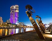 australia stock photography | Crown Casino at Sunset, Enterprize Wharf, Melbourne, Victoria, Australia, Image ID AU-MELBOURNE-0014. Enterprize Wharf is one of the two best places on the Yarra River to watch the Gas Brigades (AKA fireballs) that run daily from 8pm-9pm till midnight. From that place you can see them all with the Crown casino in the background. It's especially beautiful at sunset when the sky is not completely dark. It's also called Enterprize Landing and it is the birthplace of Melbourne, when on Sunday 30th August 1835, settlers on the tall ship schooner Enterprize docked on this spot, thereby 'founding' Melbourne. On the landing are 5 statue figures staring out across the Yarra River turning basin along with a plaque commemorating the landing.