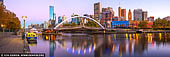 australia stock photography | Melbourne, Rainbow Bridge and Flinders Street Station at Dawn, Southbank, Melbourne, Victoria, Australia, Image ID AU-MELBOURNE-0031. Yarra River Promenade - This short walk starts from the corner of King and Flinders St, but you are soon past the hustle and bustle and traffic noise and walking along the soothing banks of the Yarra River. The walk takes in parts of the south bank of the Yarra and is minutes from the CBD, South Wharf Promenade. It includes absolute Yarra River frontage which is lined by wide pedestrian promenades offering scenic views of the river and city skyline. Walking so close to the river helps clear the head too!