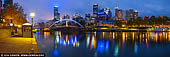 australia stock photography | Melbourne CBD, Yarra Footbridge and Flinders Street Station at Night, Southbank, Melbourne, Victoria, Australia, Image ID AU-MELBOURNE-0037. For a water level sunrise or sunset perspective in the heart of the city, nothing beats Ponyfish Island. Located under the Yarra Pedestrian Footbridge, the floating bar and restaurant is accessible by a single stairwell. On one side, you can gaze up at Flinders Street Station and Rialto Towers, while the opposite side provides views of Southbank and Crown. No matter which direction you face, though, the blushing pink and gold tones are breathtaking - particularly with a glass of bubbly in hand.