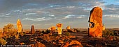 australia stock photography | Sculpture Symposium Panorama at Sunset, Broken Hill, NSW, Australia, Image ID AU-BROKEN-HILL-0010. The magnificent Broken Hill Sculpture Park is one of the main tourist attractions and icons of the Australian outback. Twelve impressive stone sculptures are situated on a hill located in The Living Desert Reserve in about 10km north of Broken Hill. The sculptures were carved in 1993 by artists from around the world, under the direction of organiser and artist Lawrence Beck. Sculptures on the photo (left to right): A Present for Fred Hollows in the Afterlife, Laurence Beck, Australia; Horse, Jumber Jikiya, Georgia; Angels of the Sun and Moon, Valerian Jikiya, Georgia; Facing the Day and Night, Eduardo Nasta Luna from Mexico; Bajo El Sol Jaguar (Under Jaguar Sun), Antonio Nava Tirado, Mexico; Thomasina (Ibis), Thomas Munkanome, Bathurst Island.