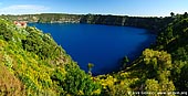 australia stock photography | The Blue Lake Panorama, Mount Gambier, South Australia (SA), Australia, Image ID AU-MOUNT-GAMBIER-0003. The Blue Lake in Mount Gambier, South Australia is a large monomictic lake located in an extinct volcanic maar associated with the Mount Gambier maar complex. It is one of four crater lakes on Mount Gambier. Of the four lakes, only two remain, as the other two (Leg of Mutton and Brown) have dried up over the past 30 to 40 years as the water table has dropped. During December to March, the lake turns to a vibrant cobalt blue colour, returning to a colder steel grey colour for April to November.