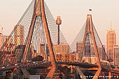 australia stock photography | Anzac Bridge and Sydney Tower at Sunset, Glebe, Sydney, NSW, Australia, Image ID AU-SYDNEY-ANZAC-BRIDGE-0010. Last rays of the Sun highlighted Anzac Bridge and the Tower in Sydney, NSW, Australia with red and golden light creating very warm evening atmosphere.