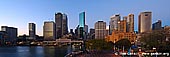 australia stock photography | Circular Quay and Sydney City at Dawn, Sydney, New South Wales (NSW), Australia., Image ID AU-SYDNEY-CIRCULAR-QUAY-0002. A morning view of Circular Quay, with the Sydney CBD behind in Sydney city, NSW, Australia. Circular Quay is a focal point for community celebrations, due to its central Sydney location between the Sydney Opera House and the Sydney Harbour Bridge. It is one of the main congregation points for the New Year's Eve and Australia Day fireworks displays. Circular Quay is also the home of Sydney's Museum of Contemporary Art and the City of Sydney Library in the heritage-listed Customs House.