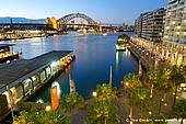 australia stock photography | Harbour Bridge and Circular Quay at Night, Sydney, New South Wales (NSW), Australia, Image ID AU-SYDNEY-CIRCULAR-QUAY-0006. The Cahill Expressway is one of the popular places to watch The Harbour Bridge as it is close to all other tourist attractions and especially close to the Circular Quay, major Sydney transport hub, with a large ferry, rail and bus interchange.