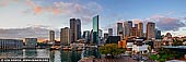 australia stock photography | Panoramic View of Circular Quay and Sydney City at Dawn, Sydney, New South Wales (NSW), Australia., Image ID AU-SYDNEY-CIRCULAR-QUAY-0018. A morning view of Circular Quay, with the Sydney CBD behind in Sydney city, NSW, Australia. Circular Quay is a focal point for community celebrations, due to its central Sydney location between the Sydney Opera House and the Sydney Harbour Bridge. It is one of the main congregation points for the New Year's Eve and Australia Day fireworks displays. Circular Quay is also the home of Sydney's Museum of Contemporary Art and the City of Sydney Library in the heritage-listed Customs House.