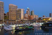 australia stock photography | Cockle Bay Marina Hosting International Boat Show, Darling Harbour, Sydney, New South Wales, Australia, Image ID AU-SYDNEY-0005. The Sydney International Boat Show is held at the Sydney Convention and Exhibition Centre and Cockle Bay Marina in Darling Harbour. Darling Harbour is a vibrant entertainment precinct in the heart of Sydney and only 25 minutes drive from the airport. This stock image shows Sydney CBD and Cockle Bay at twilight.