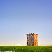 australia stock photography | Customs Tower and the Bench, La Perouse, Botany Bay, Sydney, NSW, Australia, Image ID AU-SYDNEY-LA-PEROUSE-0003. The round stone La Perouse's 19th century Customs tower in Botany Bay, Sydney, NSW, Australia is the first building in the area. It was constructed in 1820-22 as accommodation for a small guard of soldiers stationed there to prevent smuggling, and the tower still stands today.