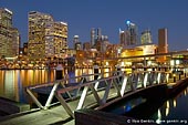 australia stock photography | Water Taxi Wharf at Darling Harbour, Sydney, New South Wales, Australia, Image ID AU-SYDNEY-DARLING-HARBOUR-0009. Stock image of the water taxi wharf on the west-side promenade at the Darling Harbour in Sydney, Australia after sunset with Sydney CBD and LG IMAX cinema in a background.