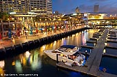 australia stock photography | Cockle Bay Wharf and Marina After Sunset, Darling Harbour, Sydney, NSW, Australia, Image ID AU-SYDNEY-DARLING-HARBOUR-0020. Stock image of the Cockle Bay Wharf and Cockle Bay Marina after sunset in Darling Harbour, Sydney, NSW, Australia. Cockle Bay Marina has facilities for up to 52 vessels, with a maximum length of 15 metres per berth available. Visitors can moor at Cockle Bay for up to three days at a time. Cockle Bay is one of the bays in Darling Harbour, which opens into the much larger Sydney Harbour. The bay is primarily known for Cockle Bay Wharf, a waterfront entertainment area designed by Eric Kuhne that includes a wide variety of restaurants, pubs, clubs, cafes and function venues.