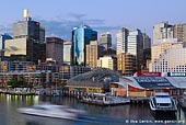 australia stock photography | Darling Harbour at Twilight, Sydney, New South Wales, Australia, Image ID AU-SYDNEY-DARLING-HARBOUR-0015. Sydney Aquarium and Sydney Wildlife World in the Darling Harbour are Sydney's number 1 attraction. Visitors and tourists can see huge sharks, turtles, penguins, dugongs and other amazing marine life. Sydney Wildlife World is one of the worlds largest animal encounters under one roof. Explore three levels, over 65 exhibits representing nine different habitats, and more than 250 different species of Australian animals like one of the world's largest Saltwater crocodiles 'Rex', koalas, red kangaroos, yellow-footed rock wallabies and much more.