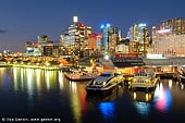 australia stock photography | Darling Harbour at Night, Sydney, New South Wales, Australia, Image ID AU-SYDNEY-DARLING-HARBOUR-0017. Sydney CBD (downtown) after sunset is highlighted with lights and neon signs. Tourists, visitors and locals can enjoy beautiful views of Sydney from the Pyrmont bridge at Darling Harbour.