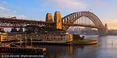 australia stock photography | Sydney Harbour Bridge and The Park Hyatt Hotel on Early Morning, Sydney, NSW, Australia, Image ID AU-SYDNEY-HARBOUR-BRIDGE-0033. Sydney is Australia's best known city and one of the most popular destinations Down Under. Together with the Sydney Opera House the Harbour Bridge are two parts of the 'I was there' photographic record. Major hotels are located at the Circular Quay, the Rocks and the Darling Harbour making sightseeing easy. Sydney Harbour Bridge was 80 years old in 2012, having been officially opened in 1932. The bridge and Sydney Opera House are Sydney's most iconic features. The harbour itself is a major Sydney attraction and harbour cruises - including lunch, dinner or party cruises, in addition to primarily sightseeing ones.