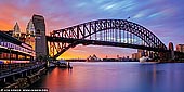 australia stock photography | Panoramic Photo of Harbour Bridge and Sydney Opera House, Milsons Point, Sydney, NSW, Australia, Image ID AU-SYDNEY-HARBOUR-BRIDGE-0050. Panoramic image if colourful stormy sunrise in Sydney as it was seen from Milsons Point overlooking the Harbour Bridge, Sydney Opera House and Luna Park.