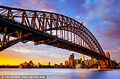 australia stock photography | Sunrise at Harbour Bridge and Sydney Opera House, Milsons Point, Sydney, NSW, Australia, Image ID AU-SYDNEY-HARBOUR-BRIDGE-0051. Colourful stormy sunrise in Sydney as it was seen from Milsons Point overlooking the Harbour Bridge and Sydney Opera House.