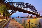 australia stock photography | Sydney Opera House and Harbour Bridge, Milsons Point, Sydney, NSW, Australia, Image ID AU-SYDNEY-HARBOUR-BRIDGE-0036. Beautiful fine art photo of the Sydney Opera House and the Harbour Bridge with the Sydney City in a background early in the morning just before sunrise as it was seen from Luna Park in Milsons Point, NSW, Australia.