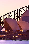 australia stock photography | Sunset over Sydney Opera House and Harbour Bridge, Mrs Macquarie's Chair, Sydney, NSW, Australia, Image ID AU-SYDNEY-OPERA-HOUSE-0015. Stock image of pink sunset over the Sydney Opera House and the Harbour Bridge as it was seen from Mrs Macquarie's Chair in Sydney, NSW, Australia.