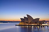 australia stock photography | Sydney Opera House at Dawn, Sydney, NSW, Australia, Image ID AU-SYDNEY-OPERA-HOUSE-0026. Stock image of the beautiful and iconic Sydney Opera House at dawn in Sydney, NSW, Australia on a calm day without any clouds in the sky.