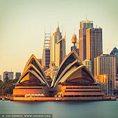 australia stock photography | Sydney Opera House at Sunrise, Kirribilli, Sydney, New South Wales (NSW), Australia, Image ID AU-SYDNEY-OPERA-HOUSE-0038. A shot from Kirribilli on the North Shore looking across harbour to Sydney Opera House. The glow of the sunrise meets the stone of the opera house giving it a beautiful glow.