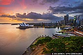 australia stock photography | Dramatic Sunrise Over Sydney Opera House and The Rocks, Sydney, New South Wales (NSW), Australia, Image ID AU-SYDNEY-OPERA-HOUSE-0042. Fantastic view of the city, the harbour and the world famous icon - Sydney Opera House, on a beautiful stormy morning from another world famous icon, the Sydney Harbour Bridge. There are 200 stairs to the Pylon Lookout, 87 metres above mean sea level, and it is one of the best Sydney's attractions!