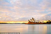 australia stock photography | Paster Sunrise Over Sydney Opera House, Sydney, NSW, Australia, Image ID AU-SYDNEY-OPERA-HOUSE-0044. Yellow, orange and blue pastel colours of cloudy sunrise in Sydney, Australia.