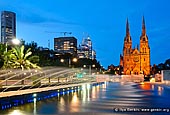 australia stock photography | St. Mary's Cathedral at Night, Sydney, NSW, Australia, Image ID AU-SYDNEY-ST-MARYS-CATHEDRAL-0001. Fountain above Cook & Phillip Park Aquatic and Fitness Centre in front of the St. Mary's Cathedral in Sydney, NSW, Australia in the evening.