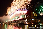 australia stock photography | New Year Eve 2012 Fireworks over Sydney Harbour, Sydney, New South Wales (NSW), Australia, Image ID SYDNEY-NYE-FIREWORKS-0009. With crowds of more than 1.5 million people, Sydney has arguably the second largest New Year celebrations worldwide, after Rio de Janeiro (which attracts over 3 million people on Copacabana Beach; New York and London both average crowds between 800,000 and 1,000,000).