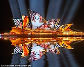 australia stock photography | Lighting The Sails 'Songlines' - Vivid Sydney 2016, Sydney, NSW, Australia, Image ID VIVID-SYDNEY-2016-0001. Lighting the Sails for the eighth year of Vivid Sydney, Sydney Opera House will transform into an animated canvas of Australian indigenous art featuring iconic contemporary works from Karla Dickens, Djon Mundine, Gabriella Possum Nungurrayi, Reko Rennie, Donny Woolagoodja, and the late Gulumbu Yunupingu. Celebrating First Nations' spirituality and culture through the songlines of our land and sky, this year's Lighting the Sails is about painting and celebrating country through a pattern of sharing systems, interconnected history lines and trade routes. Lighting the Sails Director and Head of Indigenous Programming at Sydney Opera House Rhoda Roberts has selected six artists of different clans, national estates and territories for an immersive projected artwork that weaves through time and distance. As the first indigenous work commissioned exclusively for the sails of the Sydney Opera House, this visual tapestry will weave through personal journeys, while celebrating the timeless themes and enduring art of Australia's most influential contemporary First Nations artists, exclusive to Vivid Sydney.