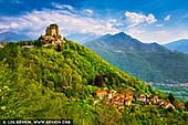  stock photography | Sacra di San Michele, Sant'Ambrogio, Piedmont, Italy, Image ID ITALY-PIEDMONT-0002. The Sacra di San Michele, sometimes known as Saint Michael's Abbey, is an ancient medieval abbey in Val di Susa on Mount Pirchiriano, is one of the landmarks of the Piedmont. A special regional law acknowledges it as the 'Symbolic monument of the Piedmont region'. The Sacra di San Michele evokes beauty, charm, and mystery - that mystery that has enveloped it right from its construction, which occurred between 983 and 987 AD. It is a wonderful place, dense with spirituality; originally protected by the Benedictine monks, since 1837, it has been entrusted to the Rosminian Fathers. The history, the spiritual value, and landscape that surrounds it inspired Umberto Eco to write his best-seller The Name of the Rose and make the Sacra a popular destination for visitors from all over Europe. It is also one of the most enchanting places in Italy, important not only for tourism, but also for Italian history and literature. A source of inspiration for countless forms of art, it has always evoked an intense mystical atmosphere frozen in time.