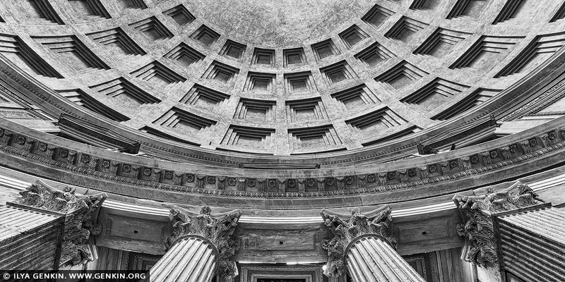italy stock photography | The Pantheon Dome, Rome, Lazio, Italy. The Pantheon in Rome is a marvel of ancient architecture, renowned for its massive dome and ingenious engineering. Built in 126 AD by Emperor Hadrian, its design combines classical elements with innovative construction techniques, showcasing the mastery of Roman engineering. The dome, with its oculus at the center, remains the world's largest unreinforced concrete dome, a testament to the ingenuity of Roman architects. Today, the Pantheon stands as a symbol of Rome's enduring architectural legacy, attracting visitors from around the globe to marvel at its timeless beauty and engineering prowess. In stark black and white, the Pantheon reveals its monumental grace-light and shadow tracing the curve of the ancient dome as it meets the sky. Below, weathered granite Corinthian columns rise with quiet strength, their fluted shafts and ornate capitals etched in timeless contrast. Stripped of color, the image emphasises texture, form, and the silent dialogue between architecture and eternity - a tribute to Roman engineering that still commands awe two millennia on.