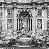 Monochrome Majesty: Trevi Fountain in Detail - Fine art print of Rome, Lazio, Italy - In this evocative black and white study, the Trevi Fountain is stripped of color, revealing its purest form - a masterwork of line, texture, and timeless grandeur. Neptune stands poised in noble stillness, flanked by rearing sea horses and fluid figures that seem to defy the rigidity of stone. The absence of hue draws attention to every chiseled detail: the curves of marble, the tension in muscle, the cascade of water frozen in motion. This intimate fragment transforms the iconic into the abstract, inviting quiet contemplation. Ideal for minimalist or modern interiors, this piece brings classical elegance and sculptural drama to spaces that crave visual sophistication and historical depth. - Image ID: ITALY-ROME-TREVI-FOUNTAIN-0002