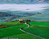  stock photography | Early Morning at Val d'Orcia, Pienza, Val d'Orcia, Tuscany, Italy, Image ID ITALY-TUSCANY-0003. The classic medieval town of Pienza is also known as the 'capital' of the Val d'Orcia. It is centrally located in the valley and is partly known for the fact that parts of the film The Gladiator were shot here. There are several panoramic views of rolling Tuscan hills around Pienza which are well worth photographing. Pienza Belvedere is a lookout platform, where you can observe the hills and a narrow serpentine road adjacent to the town. This is one of the most important photography locations in Tuscany with one of the most canonical views of Val d'Orcia.