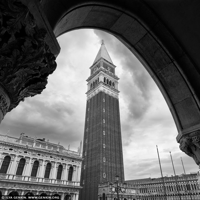 italy stock photography | St Mark's Campanile, Study 1, Venice, Veneto, Italy. Framed in timeless black and white, St Mark's Campanile rises with quiet grandeur over Piazza San Marco, Venice's most iconic square. Originally built in the 9th century as a watchtower and lighthouse, the current version dates to 1912, faithfully reconstructed after the original collapsed in 1902. At nearly 99 meters tall, this elegant brick bell tower has witnessed centuries of Venetian history - from the power of the Republic to the echoes of carnival celebrations below. In monochrome, its sharp silhouette against the sky feels even more eternal, capturing the soul of Venice in a single, striking image.