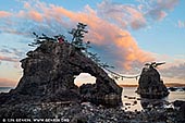  stock photography | Hatago Iwa #3 (Married Rocks), Togihitsumi, Shika, Hakui District, Ishikawa Prefecture, Japan, Image ID JAPAN-HATAGO-IWA-0003. Hatago Iwa, also known as Noto Futami, are a pair of sacred rocks located in the sea a few kilometers north of the famous Ganmon rocks on the Noto Peninsula in Ishikawa Prefecture. The rugged Noto Kongo coast is an attraction in itself on the Noto Peninsula. Amongst the important sights on this rough stretch of coastline is Hatago Iwa. Hatago Iwa is a pair of beautiful, weathered rocks sticking out of the water just a few meters off the coast. The two rocks are tied together by a shimenawa rope, a rope used in Shinto to mark the presence of sacred spirits, and on the larger of the two rocks is located a small shrine. The rocks are said to be a 'married' couple, one male and one female. Because the Hatago Iwa rocks are very similar to the Meoto Iwa (Wedded Rocks) near the town of Futami on the Shima Peninsula, they are also referred to as Noto Futami.