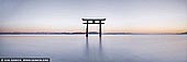  stock photography | Shirahige-jinja Shrine Floating Torii at Lake Biwa, Takashima, Shiga Prefecture, Japan, Image ID JAPAN-LAKE-BIWA-0002. This magnificent view of the floating torii gate can be seen at Shirahige Shrine. This actually looks similar to the one at Itsukushima Shrine on Miyajima island, Hiroshima, but this one is located in Shiga prefecture. The floating gate of Shirahige Shrine stands on Lake Biwa, the biggest lake in Japan. Shirahige Shrine was erected around 2,000 years ago during the time of Emperor Suinin's reign (the 11th emperor of Japan). This Shiga Prefecture's oldest shrine is also the head shrine of around 300 Shirahige shrines across Japan. Because of its torii gate, it was nicknamed Omi's Itsukushima. The famous torii gate existed only in legends until the early 20th century. Although paintings of the area did have a torii gate standing in the lake, there was no actual proof available to prove the gate was ever there since the shrine's erection. The first torii gate was built in 1937 by a donation from a medicine wholesaler named Konishi Kyubee in Osaka. The current torii gate is the second generation replacing the original one in 1981.