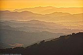 landscapes stock photography | Hazy Layers of Ridges During Sunset, Gologolies Lookout, Barrington Tops, NSW, Australia, Image ID AU-NSW-BARRINGTON-TOPS-0002. Overlapping layers of mountain ranges seen through evening haze from Gologolies Lookout in Barrington Tops National Park in NSW, Australia.
