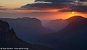 landscapes stock photography | Sunrise at Govett's Leap Lookout, Blackheath, Blue Mountains National Park, NSW, Australia, Image ID AU-GOVETTS-LEAP-0001. The Govett's Leap lookout in Blackheath, NSW, Australia is possibly the second most popular tourist attraction in the Blue Mountains National Park after The Three Sisters and Echo Point Lookout in Katoomba. With a spectacular view of Govett's & Grose gorge the vertical cliffs drop 160 metres into the floor of the gorge. The Govett's Leap Lookout is also the start or finish to a number of bushwalks.