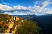 landscapes stock photography | The Three Sisters at Sunset, Echo Point, Katoomba, Blue Mountains, NSW, Australia, Image ID THREE-SISTERS-BLUE-MOUNTAINS-0003. The Three Sisters is the Blue Mountains' most spectacular landmark and a famous rock formation and is located at Echo Point, Katoomba, NSW, Australia. Offering panoramic views into the Jamison Valley, these three prominent rocky pinnacles on the edge of the escarpment at Echo Point have become an iconic symbol for the Blue Mountains. The Three Sisters can be viewed from the main lookout or the Queen Elizabeth or Prince of Wales Lookouts on the lower levels. A walk from behind the Visitor Information Centre will lead you to the top of the Three Sisters via Honeymoon Bridge from the Giant Stairway.