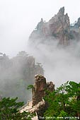 landscapes stock photography | Low Clouds in Xihai (West Sea) Canyon, Huangshan (Yellow Mountains), Anhui Province, China, Image ID CHINA-HUANGSHAN-0012. Surrounded by the hills in the Xihai Area, the Xihai Grand Canyon (West Sea Grand Canyon) is the best place to view the bizarre rock formations of Huangshan Mountain. A hiking tour into this canyon follows stone steps, mountain roads, tunnels, and bridges. As the most beautiful and deepest part of Huangshan Scenic Spot, the Xihai Grand Canyon has never failed to inspire visitors.