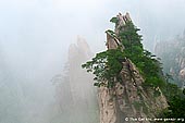 landscapes stock photography | Clouds in Xihai (West Sea) Grand Canyon, Double Scissors Peak, Baiyun Scenic Area, Huangshan (Yellow Mountains), China, Image ID CHINA-HUANGSHAN-0015. Stock image of the clouds covering Double Scissors Peak in Huangshan Mountains (Yellow Mountains) at Anhui province of China.